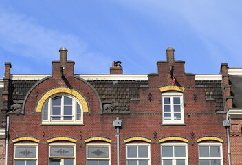 Naklejka premium Amsterdam Marnixstraat Brick Building Facade with Different Gables Close Up, Netherlands