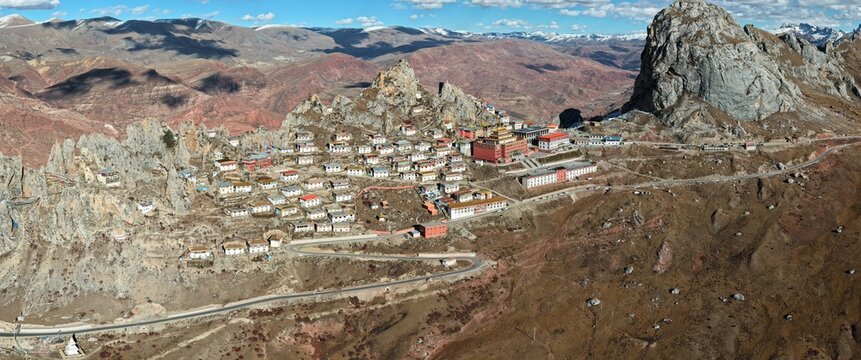 Aerial panorama of Zizhu Monastery perched on a sacred rocky peak, Tibet, China
