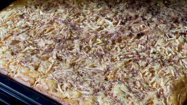 Apple charlotte on a baking sheet in the oven