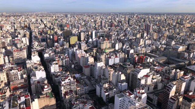 Aerial Til Down Dense Populate Cityscape in Buenos Aires Argentina, Drone view Rooftops and Street Traffic, Skyline to Central Neighborhood
