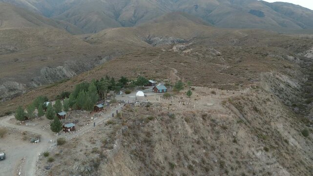 Cinematic drone orbit around Observatorio Astronomico Ampimpa surrounded by the rugged mountain landscapes of Tucum&aacute;n, Argentina.