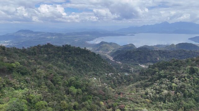 Panoramic Aerial View of Lake Yojoa Surrounded by Coffee-Growing Mountains in Honduras, Natural Tourism and Landscape Conservation