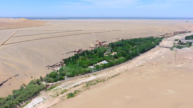 Aerial view of the Mogao Grottoes in Dunhuang, Gansu, China, showcasing the Buddhist statues and murals carved into the caves, and highlighting the art of Chinese murals.