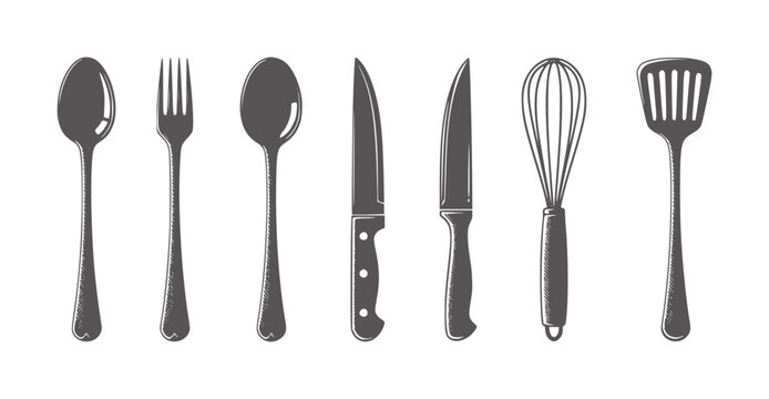 Collection of dark gray kitchen utensils including spoons forks knives whisk and spatula