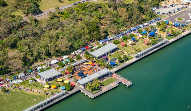 Australian waterfront park with promenade and social activity