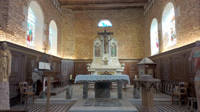 Cinematic interior tour of the historic Catholic church in Parfondeval village, France with ornate altar and crucifix