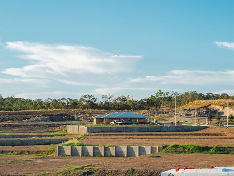 Australian land development with terraced earthworks and building