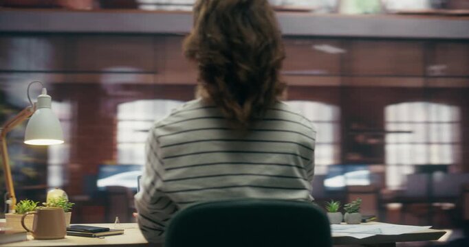 360 Degree. Caucasian Woman Types on Laptop at Creative Office Desk, Focused on Programming Software and Ecommerce Data Analysis for Digital Business Productivity. Orbital Cinematic Arc Shot