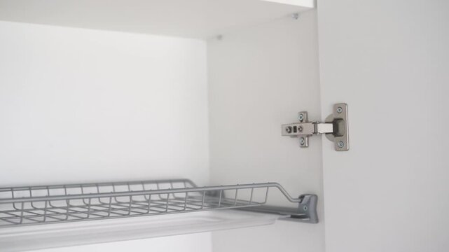Cabinet drawer pull out shelf mechanism with metal hinge