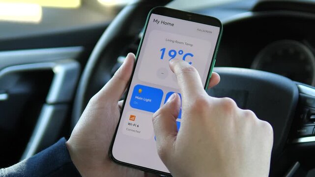 Hand interacting with a smart home widget on a mobile screen. Tapping the temperature control to adjust from 18 degree to 20 degree . Ideal for IoT app design, user interaction, and smart device UX