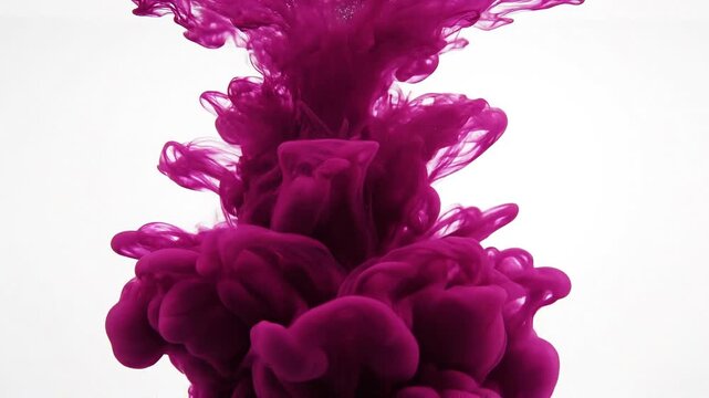 Purple Ink Cloud: A mesmerizing swirl of vibrant purple ink dissolves in clear water, creating an abstract, ethereal cloud formation that captivates the eye.