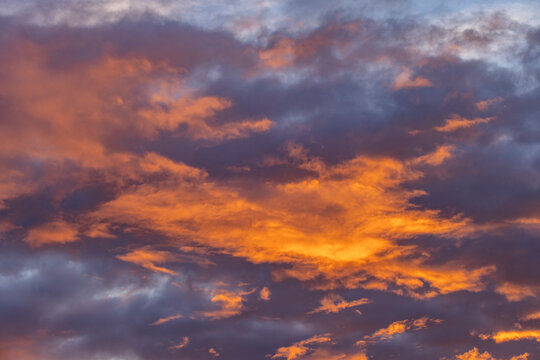 Golden clouds against sky at sunrise