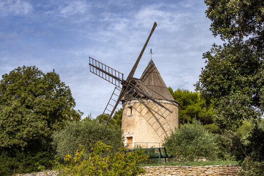 Antique windmill in rural landscape
