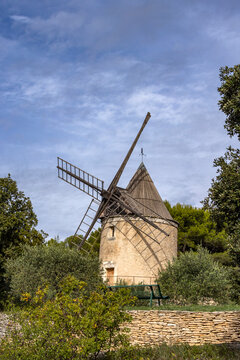 Antique windmill in rural landscape