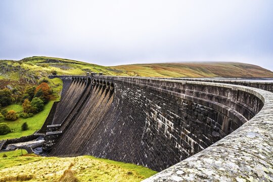 Autumn colors over Claerwen Dam, Claerwen Valley, Elan Valley Reservoir, Rhayader, Powys, Wales, UK