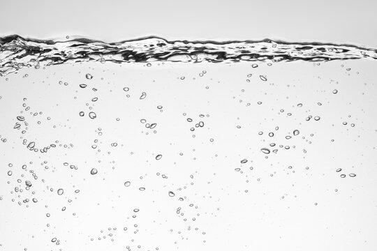 Air bubbles under water rising forming an abstract pattern