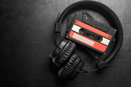 Headphones and audio cassette tape creating retro music vibe