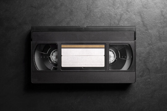 Retro VHS video cassette tape on dark background
