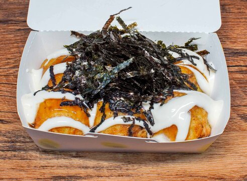 Toasted bread topped with seaweed and creamy sauce for a savory snack