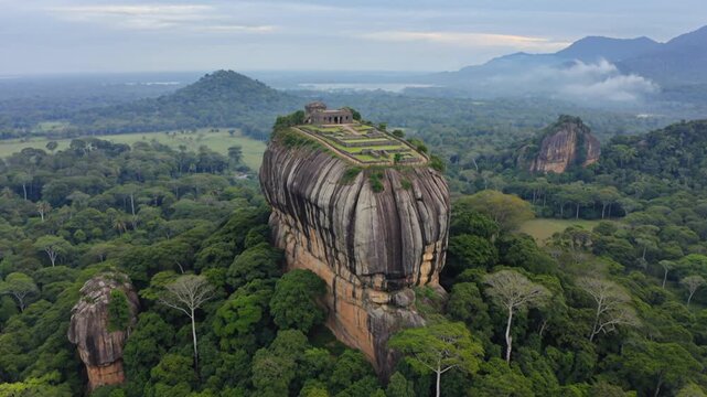 Sigiriya rock fortress, aerial view and ancient ruins in Sri Lanka with jungle, mountains and forest. Lion rock, landmark and historic site for travel, tourism and historical heritage discovery tour