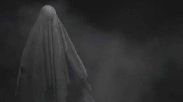 Scary Sheet Ghost Levitating in Dark Misty Night Halloween Horror Concept