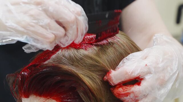 Mother dyes teenage daughter's hair red at home 