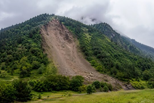 Mountain slope showing recent landslide and erosion damage