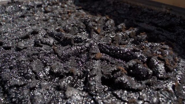 Soot and creosote on fireplace interior wall close-up