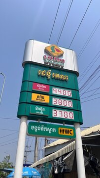 TELA PTT gas station price totem display showing fuel costs for super regular and diesel gasoline in local currency - Siem Reap, Cambodia, March 20, 2025