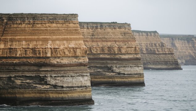 Oceanfront cliffs revealing multiple sedimentary layers of limestone sandstone siltstone and mudstone