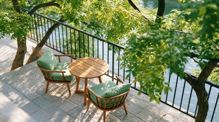 Obraz premium Peaceful outdoor terrace with wooden furniture by the river under trees