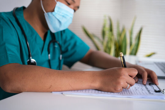 Person, dokter, nurse and hands writing with document for medical prescription, patient records or inusrance at hospital. closeup or doctor with notes or filling health form, survey or application
