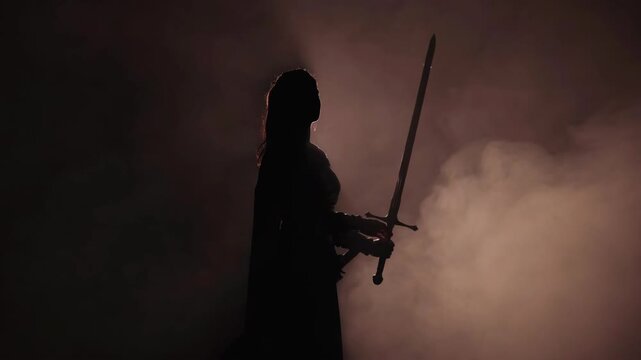 Silhouette of a woman with a sword in cinematic style on a dark smoky background, symbolizing strength and determination