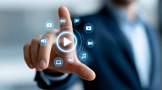 Businessman's hand near a dynamic holographic play button surrounded by multimedia icons, digital content marketing, corporate media strategy, online advertising, defocused