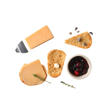 Norwegian brown cheese brunost with caramelized color and cheese slicer isolated on white.