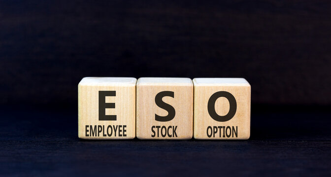 ESO employee stock option symbol. Concept words ESO employee stock option on beautiful wooden blocks. Beautiful black background. Business ESO employee stock option concept. Copy space.