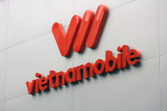 DANANG, VIETNAM - JANUARY 22, 2026: The corporate logo and 3D sign letters of Vietnamobile mobile network operator on a building wall facade.