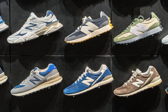 Various footwear displayed inside New Balance store in shopping mall. The range of New Balance sneakers in the outlet store. Minsk, Belarus - March 31, 2025