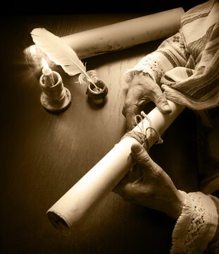 Man holding an old scroll