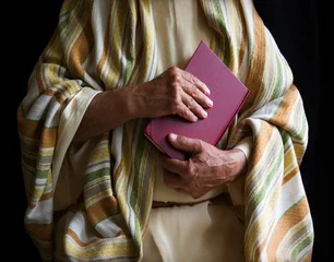 Old man holding a book © Marina