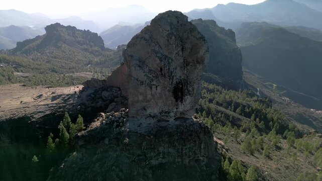 Aerial view of Roque Nublo a peak and monolith in Gran Canaria located in the center of the island, a mountain mass of volcanic origin, one of the most characteristic symbols of the island, Gran Canar