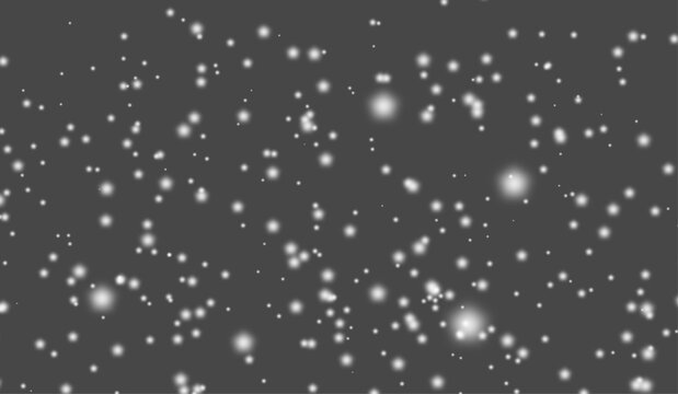Heavy falling snow background with white winter snowflakes on dark grey backdrop.