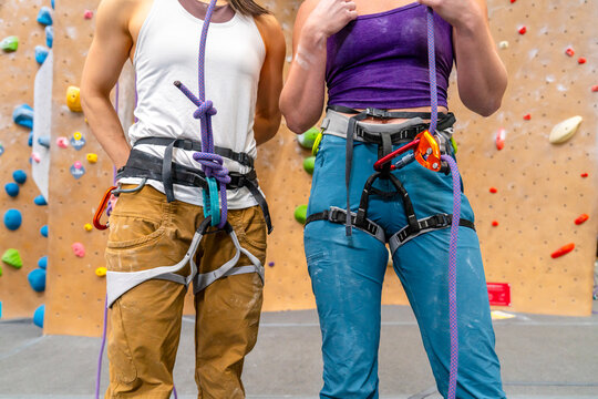 Rock climbers top rope inside gym 