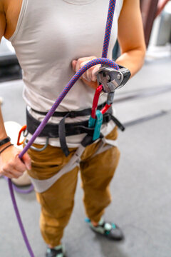 closeup rock climbing belaying technique gri gri device