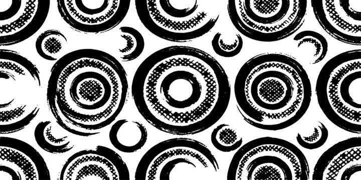 An abstract pattern of black and white concentric circles with a brushstroke texture, creating a modern and artistic design.
