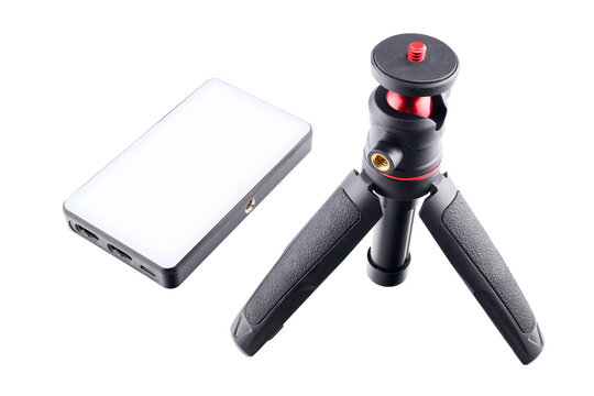 opened small tripod three-legged and flat diode lamp