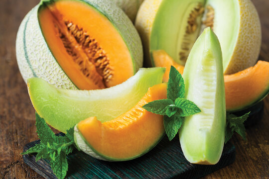 Fresh ripe melons on the wooden table	