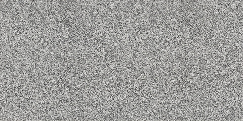 Fototapeta premium A detailed close-up of a grey, textured surface, possibly concrete or stone, showcasing a gritty and industrial aesthetic.