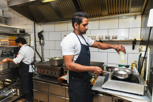 Chef cooking on professional induction stove