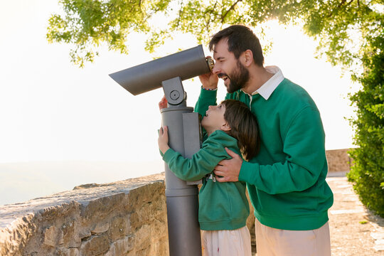 Father and child viewing countryside